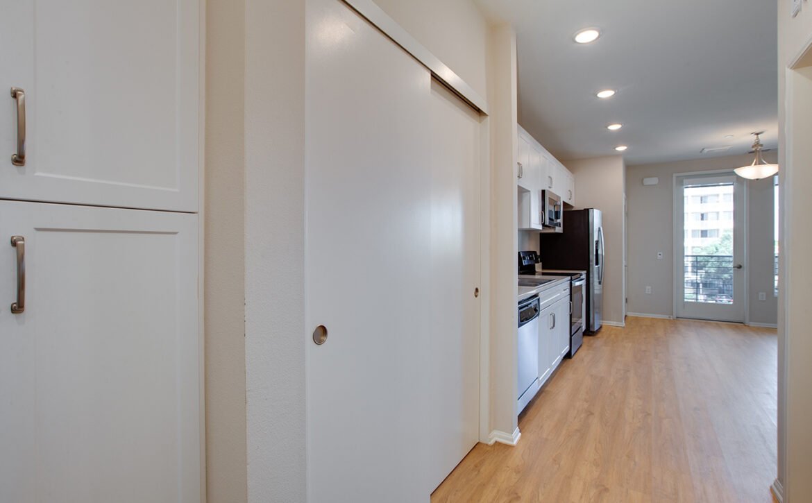 Studio apartment interior at C+C Flats in Chula Vista, CA — open living area with modern finishes