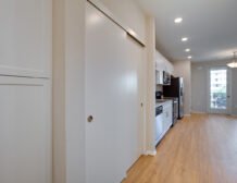 Studio apartment interior at C+C Flats in Chula Vista, CA — open living area with modern finishes