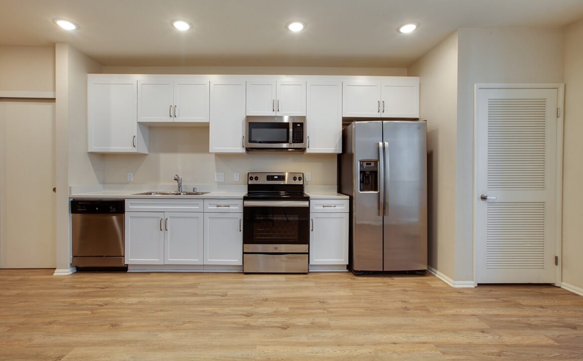 Studio apartment interior at C+C Flats in Chula Vista, CA — open living area with modern finishes