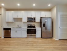 Studio apartment interior at C+C Flats in Chula Vista, CA — open living area with modern finishes