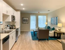 2 bedroom apartment interior at C+C Flats in Chula Vista, CA — spacious open-concept living and dining area with modern finishes