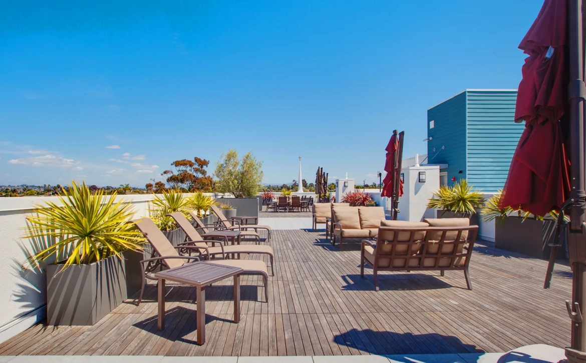 Outdoor BBQ picnic area on rooftop at C+C Flats apartment community Chula Vista