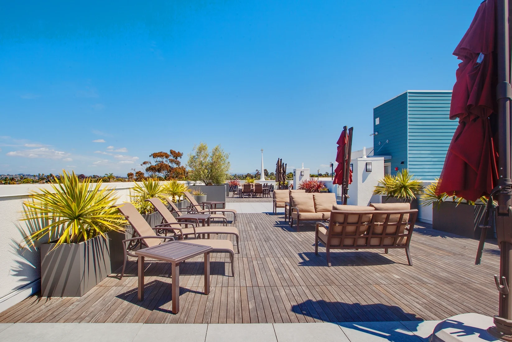 Outdoor BBQ picnic area on rooftop at C+C Flats apartment community Chula Vista