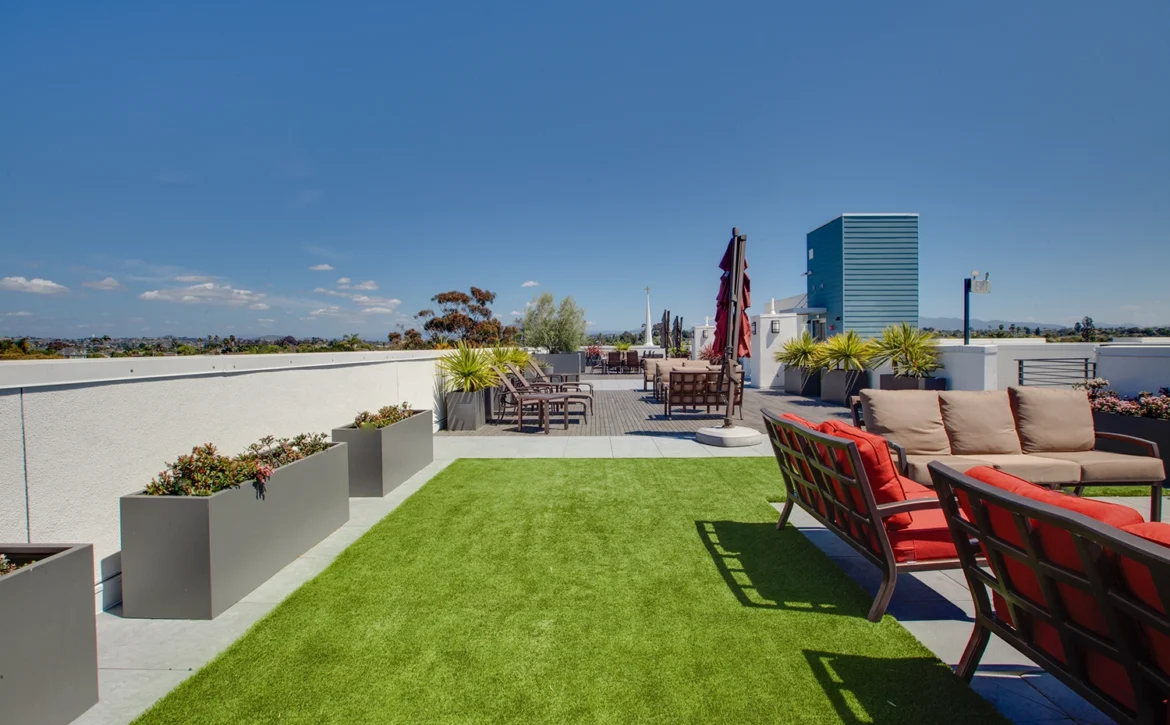 Outdoor fireplace lounge on rooftop at C+C Flats luxury apartments in Chula Vista CA