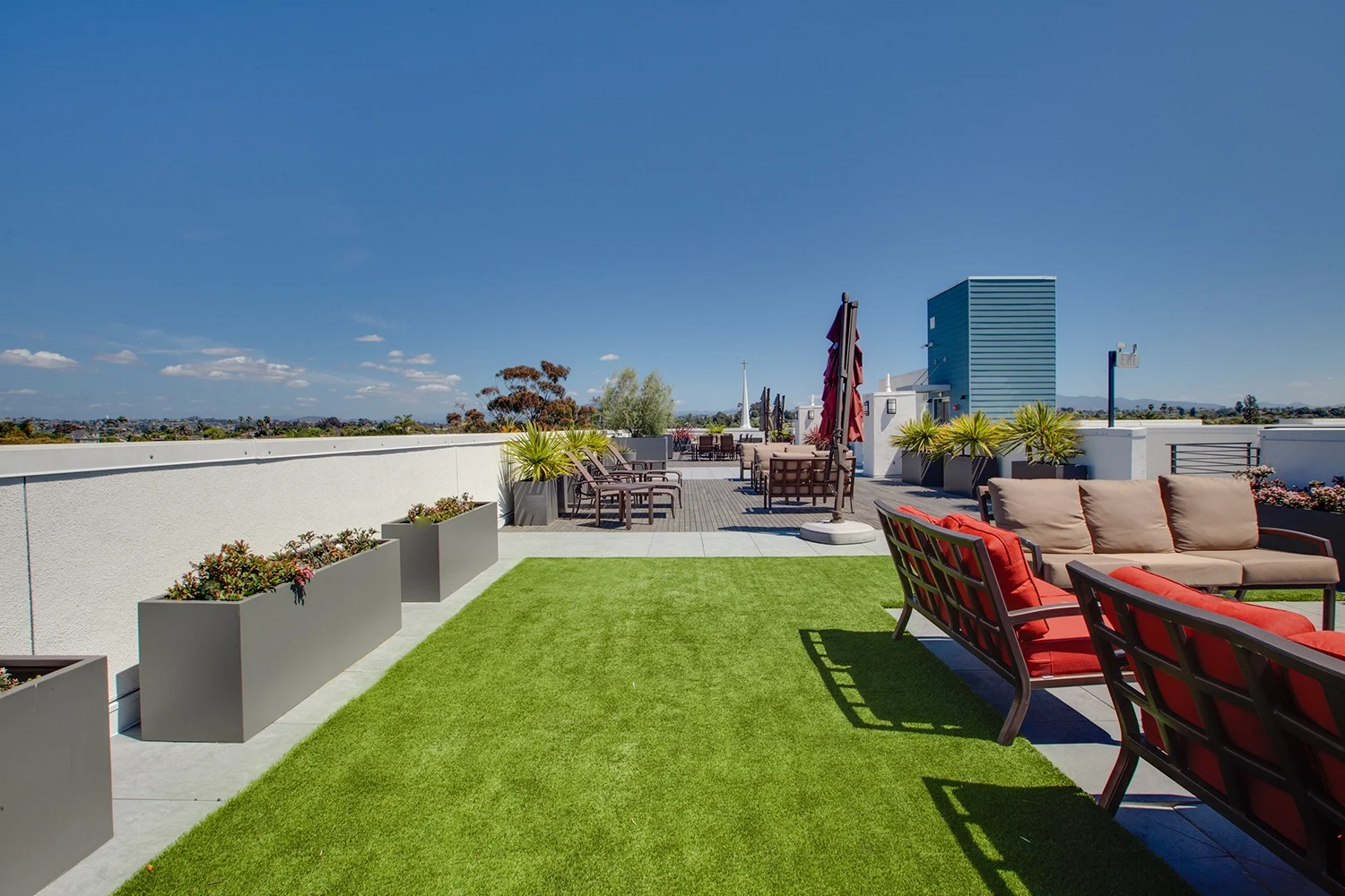 Outdoor fireplace lounge on rooftop at C+C Flats luxury apartments in Chula Vista CA