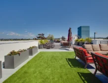 Outdoor fireplace lounge on rooftop at C+C Flats luxury apartments in Chula Vista CA